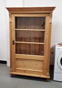 Vintage pine cabinet, the moulded cornice above glazed door, on shaped supports  Condition