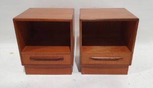 Pair of G-Plan teak bedside cabinets with open recesses and single drawers, on plinth bases with a