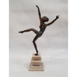 Art Deco style bronze figure of a dancing nude female, on stepped marble base, 40cm high