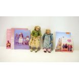 Two Annette Himstedt dolls, one in green net and floral applied dress, 26cm high and the other in
