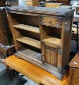 20th century oak bookcase with three shelves, one drawer over shelf and cupboard, with moulded