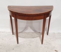 19th century mahogany and banded demi-lune fold-over card table on square section tapering supports,