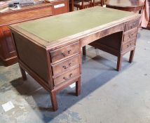 20th century desk with leather inset writing surface, six drawers, on square section supports