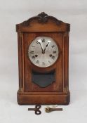Early 20th century mahogany bracket clock with Roman numerals to the steel dial, on plinth base