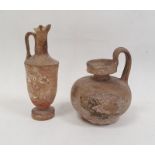 Pottery vessel of circular form with loop handle, 12cm high and a pottery ewer with traces of