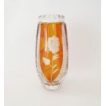 An Early 20th century Bohemian cut glass vase with amber coloured panels and etched floral