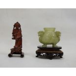 Chinese jade censer, dog of Fo mask handles, and raised on four feet, together with a carved wood