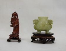 Chinese jade censer, dog of Fo mask handles, and raised on four feet, together with a carved wood