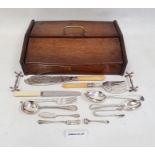 Oak cutlery box and contents including assorted silver plated flatware, knife rests, a pair of