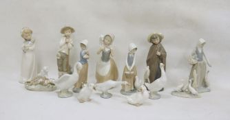 Collection of mainly Nao china figurines, a Lladro group of lamb with cheetah 6926 and a Lladro
