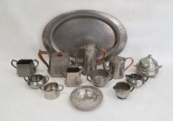 Hammered pewter oval tray, a three-piece hammered pewter teaset and various other pewter teawares