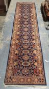 Eastern-style runner with blue ground repeating foliate pattern to central field - 350 x 85 cms