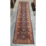 Eastern-style runner with blue ground repeating foliate pattern to central field - 350 x 85 cms