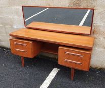 G-Plan teak mirrored dressing table, the rectangular surface with jewellery drawer, the base of four