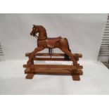 Modern pine platform rocking horse with leather saddle