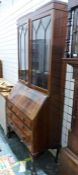 20th century mahogany bureau bookcase, the astragal-glazed doors above a base of three drawers, on