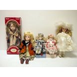 Two boxes of modern porcelain collector's dolls (2)