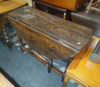 Possibly 18th century or later oak gateleg table, on turned block supports