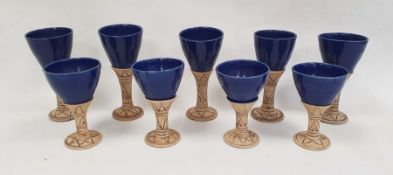 A set of studio pottery goblets with blue glazed bowls and incised decorated stems (9)