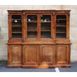 Victorian rosewood breakfront bookcase, frieze carved with beaded decoration over four glazed doors,