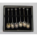 Set of six white metal coffee spoons with pearl terminals