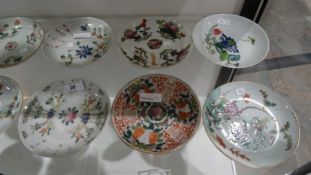 Assorted 20th century Chinese plates and saucers in famille rose colours (16)