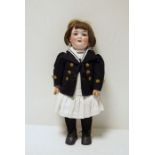 Armand Marseille bisque headed doll no.560/8, in corduroy pinafore dress with navy sailor jacket