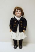 Armand Marseille bisque headed doll no.560/8, in corduroy pinafore dress with navy sailor jacket