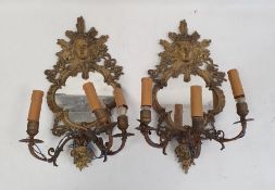 Pair of three-branch girandole wall mirrors, the brass frames with mask decoration, 44cm high (2)