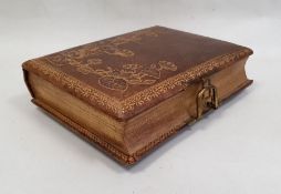 Victorian tooled leather musical photograph album, the cover decorated with waterlilies, the