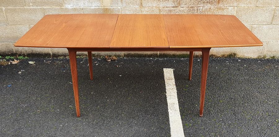 Mid century modern McIntosh teak extending dining table on tapering supports Condition