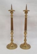 Pair of brass pricket candlesticks with fluted and knopped stems, on circular bases, 56cm high (2)
