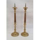 Pair of brass pricket candlesticks with fluted and knopped stems, on circular bases, 56cm high (2)