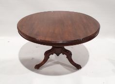 Victorian circular breakfast table with moulded edge, on turned and carved column to three ogee