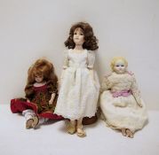An Ellie's Doll workshop all porcelain doll on stand, a Pauline's limited edition doll 'Demi' no