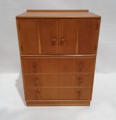 Mid century modern Meredew oak cupboard with two cupboard doors above three drawers, on plinth base,