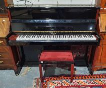 Eavestaff upright piano with iron frame, marked no.7788330 and a piano stool (2)