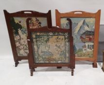 Three needlework firescreens in oak frames (3)