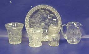 Cut glass water jug, two slice cut vases, a canister and a large cut strawberry-pattern shallow dish