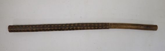 Carved wooden baton/club, possibly Oceanic, with geometric decoration and plain handle, 56cm long