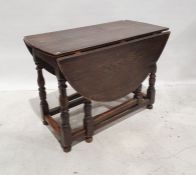 20th century reproduction gateleg table in the 18th century style, the oval top with drop leaves, on