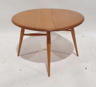 Modern Ercol coffee table with drop leaf, on beech turned supports