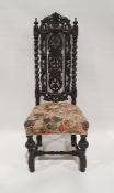20th century Charles I-style chair, the heavily carved and pierced back and upholstered seat, on