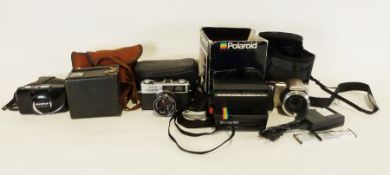 Kodak Brownie 620 camera, an Olympus digital camera, a Polaroid camera and various others (1 box)