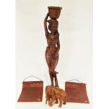 Modern carved wooden figure of an African woman, a carved wooden model of an elephant and calf and a