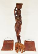 Modern carved wooden figure of an African woman, a carved wooden model of an elephant and calf and a