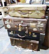 Three suitcases and a metal trunk