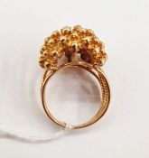 Gold ring of flowerhead design with wirework shank, unmarked, tested 18ct, approx. 11g