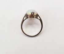 White metal ring set with an oval opal cabochon, finger size H (unmarked)