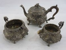 Georgian silver teaset, milk jug and sugar bowl with embossed floral decoration, the C-scroll